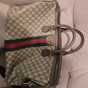 Gucci duffle bag never worn! Comes with lock and key!
